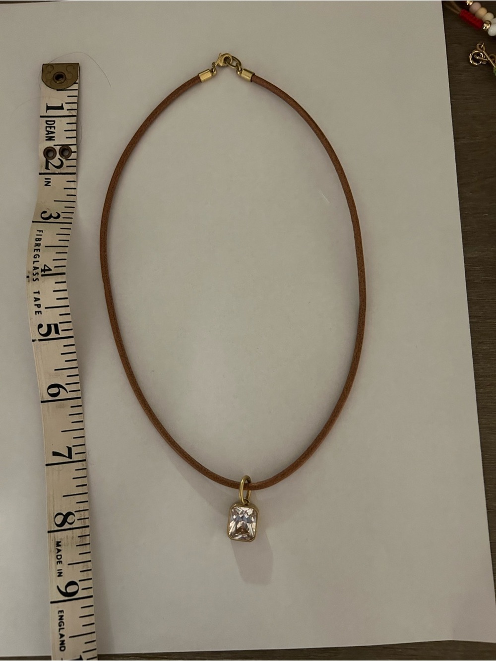 Roxanne Assoulin Brown Leather Cord Necklace with Gold CZ Drop